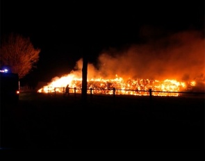 Hay bales on fire at Gestut Lewitz