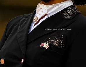 A discrete Qatari flag on the lapel of the coat of Wejdan Al Malki, one of the few desert centaurs making their way in the world of dressage :: Photo © Astrid Appels