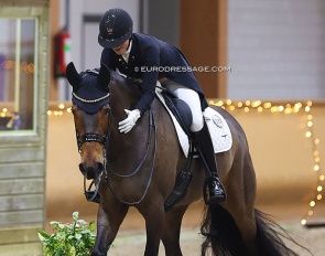 Cathrine Dufour pats the British owned Mount St. John Freestyle after their 81% earning show debut at the 2023 CDI Kronenberg :: Photo © Astrid Appels