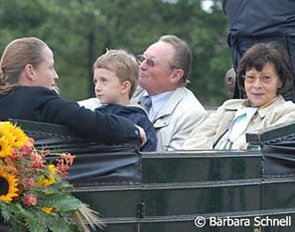 Heinrich Werth with wife Brigitte (right) and Isabell Werth (left) getting driven around her home town of Rheinberg in 2006 as part of the WEG medal winning celebration :: Photo © Barbara Schnell