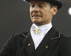 Edward Gal with a golden Glock Gun as pin for his stock tie :: Photo (c) Astrid Appels