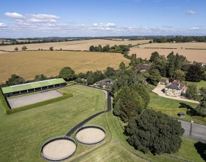 A well-appointed country house with an extensive equestrian facility including a bespoke indoor and outdoor school. 