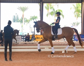 Olivia Lagoy-Weltz coaching a young rider in a clinic in Wellington :: Photo © Carmen Franco