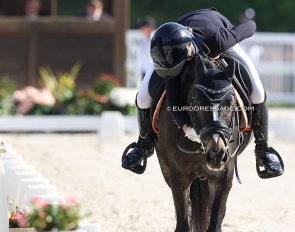 Rider hugging pony at an international competition :: Photo © Astrid Appels