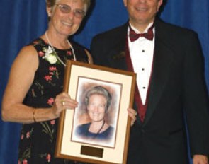 Jessica Ransehousen became an inductee into the USDF Hall of Fame. USDF president Sam Barrish presents the award :: Photo © Mary Phelps