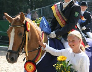 Helena Camp on her 2004 Bundeschampion Dornika. Owner Sanneke Rothenberger smiles