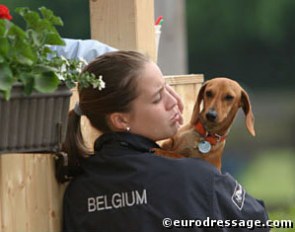 Belgian young rider Julie de Deken with her dachshund Popov