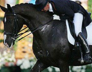 Van Grunsven hugs Salinero after finishing her Olympic freestyle ride