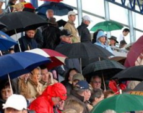 Even the audience had to open umbrella's under the covered bleachers because the rain came down so hard.