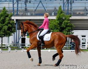 Nadine Capellmann schooling Elvis VA in the main warm up ring :: Photo © Barbara Schnell