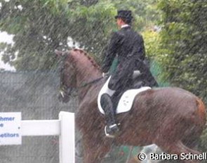 Isabell Werth and Warum Nicht stuck in a torrential down pour. The class was delayed for half an hour :: Photo © Barbara Schnell
