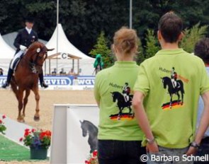 Hubertus Schmidt on Wansuele in the ring, his fans with Schmidt T-shirts are watching him