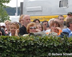 Fans crowd around the training ring to watch their idols