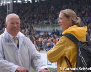 A journalist chatting with Manfred Heinrichsen, who's been the gate steward at Aachen for more than a decade.