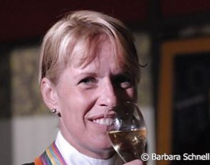 Anky van Grunsven drinking victory champagne after winning Kur gold :: Photo © Barbara Schnell