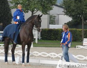 Anky van Grunsven practising the halt on Salinero. Sjef Janssen supervises