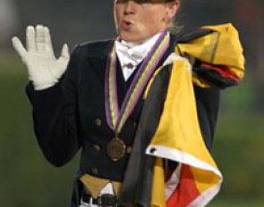 Isabell Werth. The flag on her shoulder is the "Das War Spitze" (That was Top Class) flag she got from her fans.