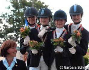 The silver medal winning Dutch team flanked by chef d'equipe Christa Laarakkers