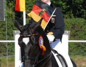 The gold medal winning Jill de Ridder and Disco Boy ride their lap of honour