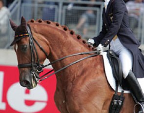 Nadine Capellmann smiling on her horse Elvis VA, a rarity