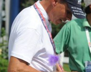 Peters signing his autograph with a girly, fluffy pen