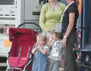 Anky van Grunsven with her children and the nanny watching the warm up.