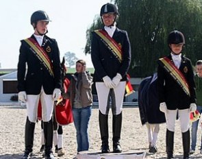 FEI Pony riders podium: Geoffrey de Roy (silver), Noemie Goris (gold), Leyla Larsson (bronze)