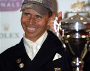Steffen Peters all smiles with his World Cup Trophy in front of him