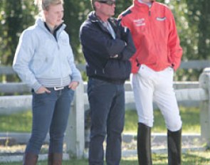 The Van Silfhout family watching one of their students ride: Jarissa, father Alex, and Diederik