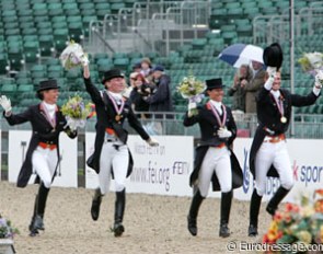 The team victory lap "sine equi" at the 2009 European Championships: Anky van Grunsven, Imke Schellekens-Bartels, Adelinde Cornelissen, Edward Gal