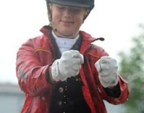 Jessica Krieg wrings water from her gloves