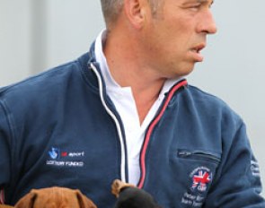 British pony team trainer Peter Storr with his two dachshund puppies