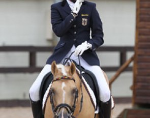 Nail biting moments for the German team as last rider Katharina Weychert leaves the arena with Golden Derano C