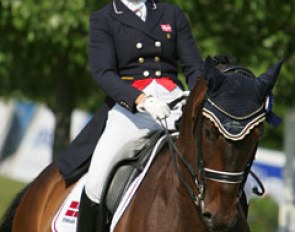 Danish Nanna Skodborg Merrald has a big smile during the prize giving. She finished 8th aboard Millibar (by Milan) with 70.263%