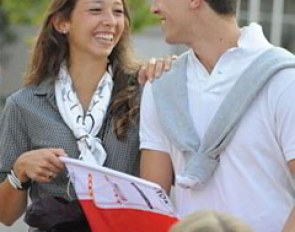 Swiss Sophie Aiko Muller sharing a laugh with a friend of a team rider