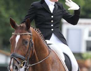 Austrian Saskia Lieben-Seutter waves to the crowds after she wraps up her ride on Du Soleil (by De Niro)