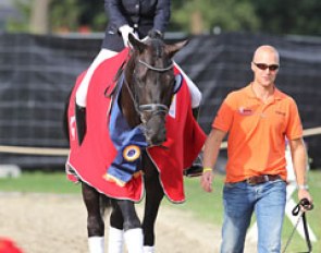 Emmelie Scholtens and boyfriend Jeroen Witte (son of horse dealer Nico Witte) guide Astrix to the show ring for the prize giving ceremony