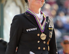 Isabell Werth smiling on the podium while receiving team bronze at the 2010 World Equestrian Games :: Photo © Astrid Appels