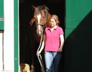 Groom Sabine Domhöver leads Girasol out of her stall