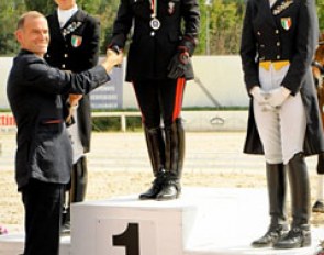 The 2011 Italian Grand Prix podium: Scolari, Truppa and Rustignoli. FISE Dressage Director David Holmes congratulates Truppa :: Photo © Marco Villanti