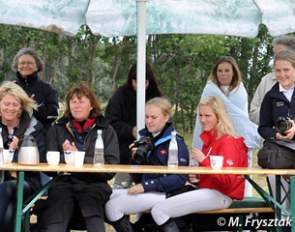 The Danish parents and riders watch their team mates