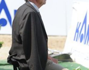 Belgian team trainer Volker Moritz watches Devroe in action