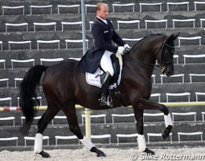 Eventing world champion Michael Jung warming up his GP horse Roche