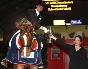 Ulla Salzgeber receives the trophy from the Reem Acra representative at the 2011 CDI-W Neumunster