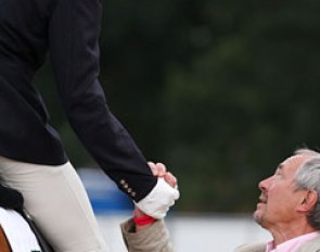 Michael Eilberg and Farouche's owner Dave Crowden shake hands and celebrate the victory