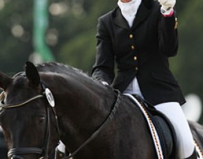 Ines Westendarp and Furstenball gives a thumbs up to her fans after putting solid 9s on the score board