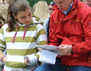 Charlotte Maria Schurmann and her trainer Oliver Oelrich looking at the order of go