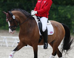 Harriette Williams warming up Madam's Miss Maria at the 2012 CDI-P Compiegne