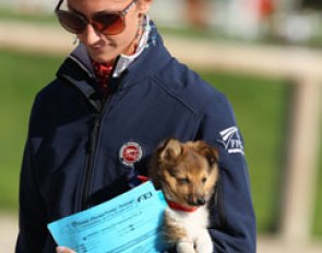 Alizee Froment's puppy has an issue to its leg and needs to be carried