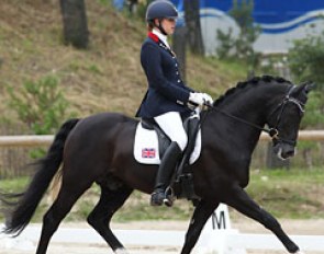 Maisie Scruton and Rembrandt. The pair does fantastic canter movements but in trot the black stallion hollows the back and he could be more consistent in the contact